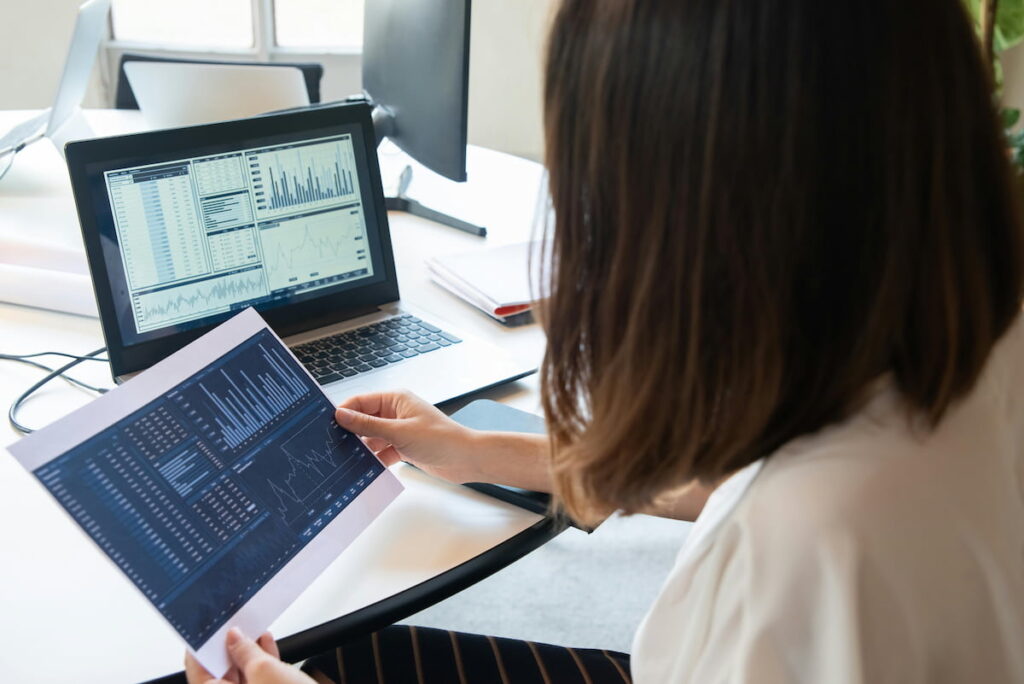 Woman looking at the business chart on the computer