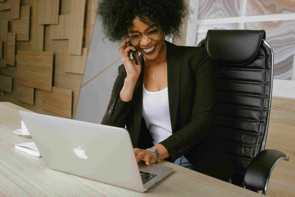 A woman engaged in a phone conversation about implementing a Live Call Program.