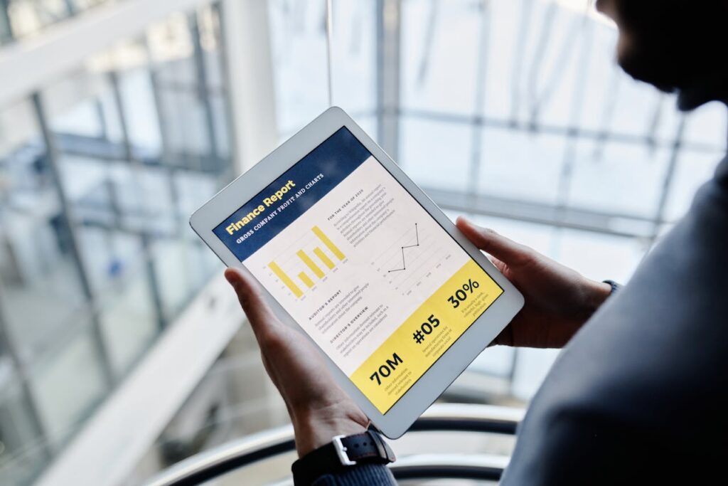 HME DME financial leader reviewing a revenue cycle profit report on a digital tablet.